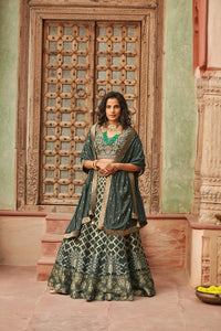 Buy stunning dark green embroidered Banarasi lehenga online in USA with dupatta. Elevate your ethnic style with a tasteful collection of designer Anarkali, designer salwar suits, designer lehengas, sharara suits from Pure Elegance Indian clothing store in USA.-full view
