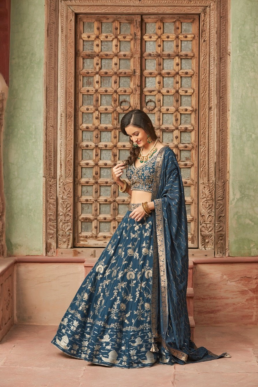 Shop gorgeous blue embroidered Banarasi lehenga online in USA with dupatta. Elevate your ethnic style with a tasteful collection of designer Anarkali, designer salwar suits, designer lehengas, sharara suits from Pure Elegance Indian clothing store in USA.-side