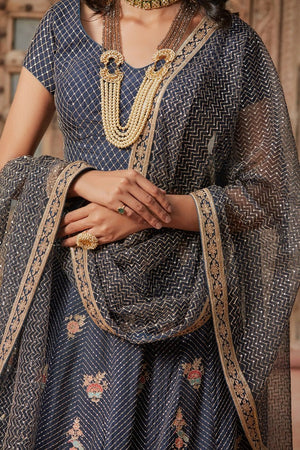 Buy stunning charcoal grey embroidered net lehenga online in USA with dupatta. Elevate your ethnic style with a tasteful collection of designer Anarkali, designer salwar suits, designer lehengas, sharara suits from Pure Elegance Indian clothing store in USA.-closeup
