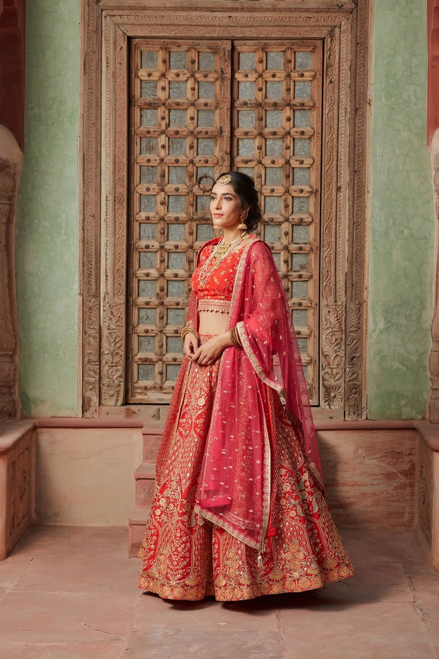 Shop gorgeous crimson red embroidered raw silk lehenga online in USA with pink dupatta. Elevate your ethnic style with a tasteful collection of designer Anarkali, designer salwar suits, designer lehengas, sharara suits from Pure Elegance Indian clothing store in USA.-side