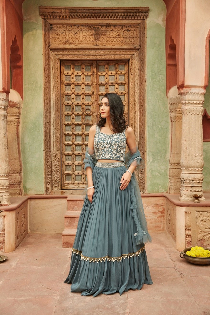 Shop grey self embroidery chinon lehenga online in USA with dupatta. Elevate your ethnic style with a tasteful collection of designer Anarkali, designer salwar suits, designer lehengas, sharara suits from Pure Elegance Indian clothing store in USA.-full view