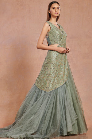 Buy beautiful sea green embroidered contemporary lehenga online in USA.  Make a fashion statement on festive occasions and weddings with designer suits, Indian dresses, Anarkali suits, palazzo suits, designer gowns, sharara suits from Pure Elegance Indian fashion store in USA.-left