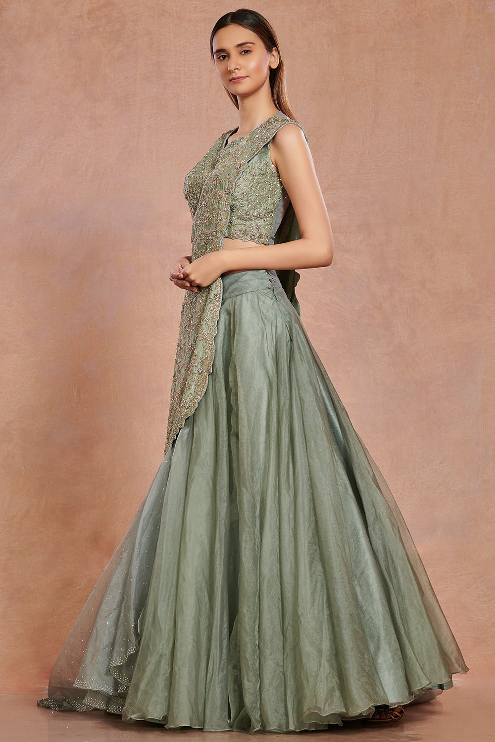 Buy beautiful sea green embroidered contemporary lehenga online in USA.  Make a fashion statement on festive occasions and weddings with designer suits, Indian dresses, Anarkali suits, palazzo suits, designer gowns, sharara suits from Pure Elegance Indian fashion store in USA.-right
