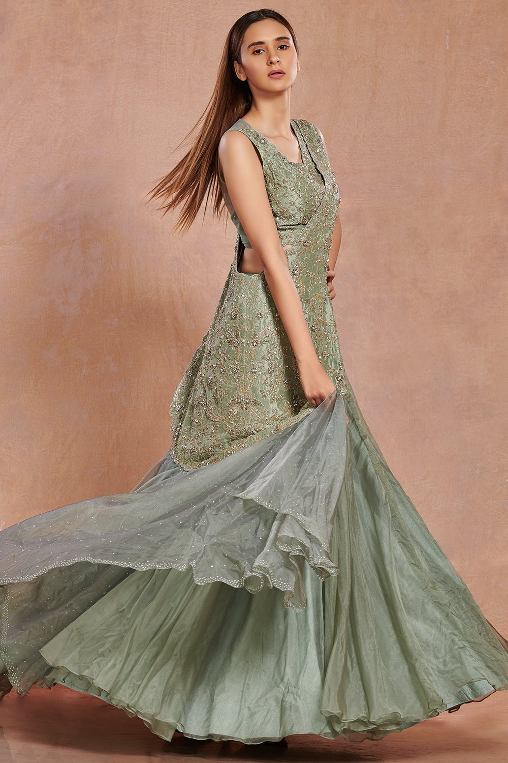 Buy beautiful sea green embroidered contemporary lehenga online in USA.  Make a fashion statement on festive occasions and weddings with designer suits, Indian dresses, Anarkali suits, palazzo suits, designer gowns, sharara suits from Pure Elegance Indian fashion store in USA.-full view