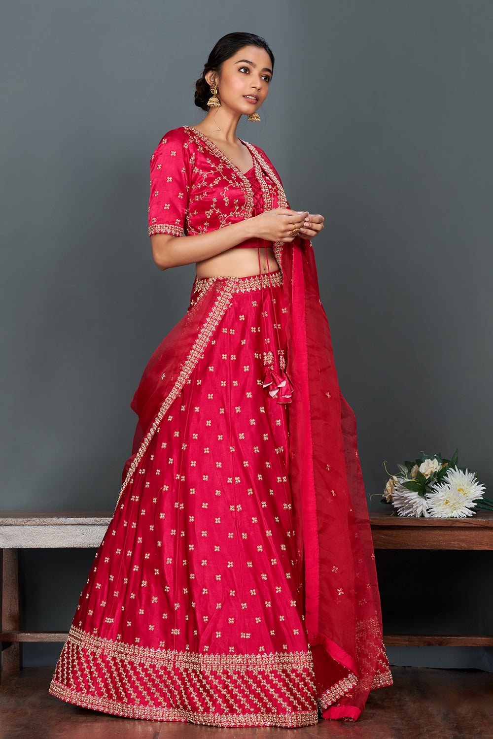 Shop stunning bright pink embroidered cotton lehenga set online in USA.  Make a fashion statement on festive occasions and weddings with designer suits, Indian dresses, Anarkali suits, palazzo suits, designer gowns, sharara suits from Pure Elegance Indian fashion store in USA.-side