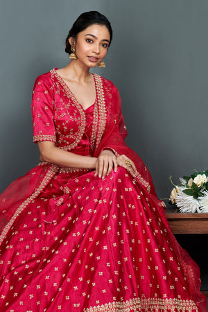 Shop stunning bright pink embroidered cotton lehenga set online in USA.  Make a fashion statement on festive occasions and weddings with designer suits, Indian dresses, Anarkali suits, palazzo suits, designer gowns, sharara suits from Pure Elegance Indian fashion store in USA.-closeup