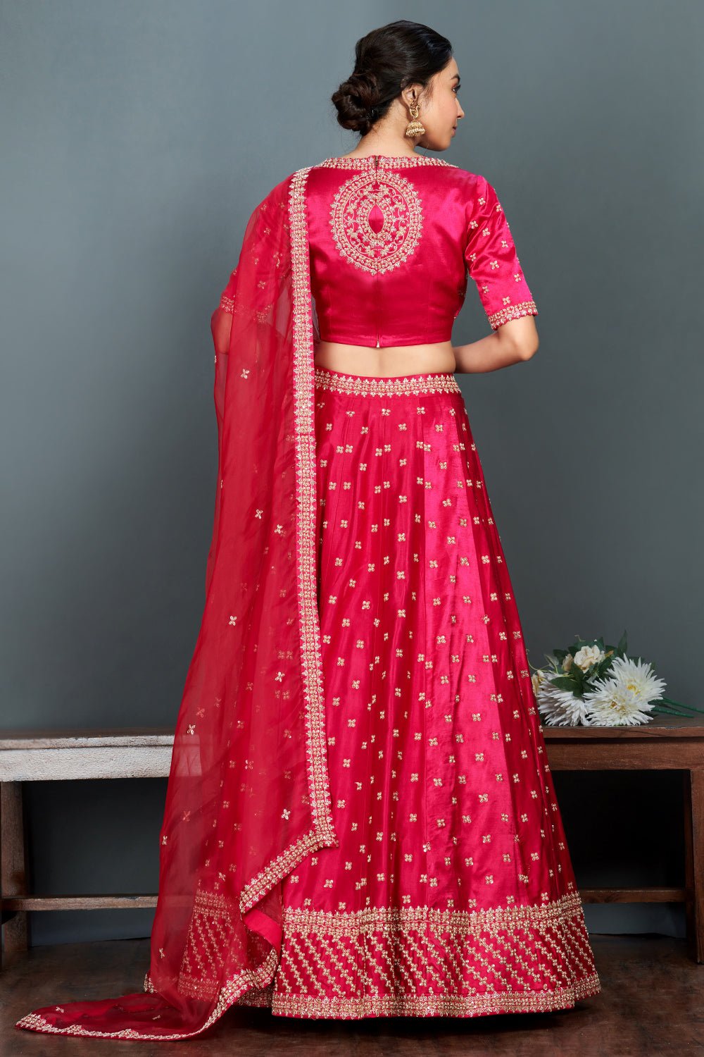 Shop stunning bright pink embroidered cotton lehenga set online in USA.  Make a fashion statement on festive occasions and weddings with designer suits, Indian dresses, Anarkali suits, palazzo suits, designer gowns, sharara suits from Pure Elegance Indian fashion store in USA.-back