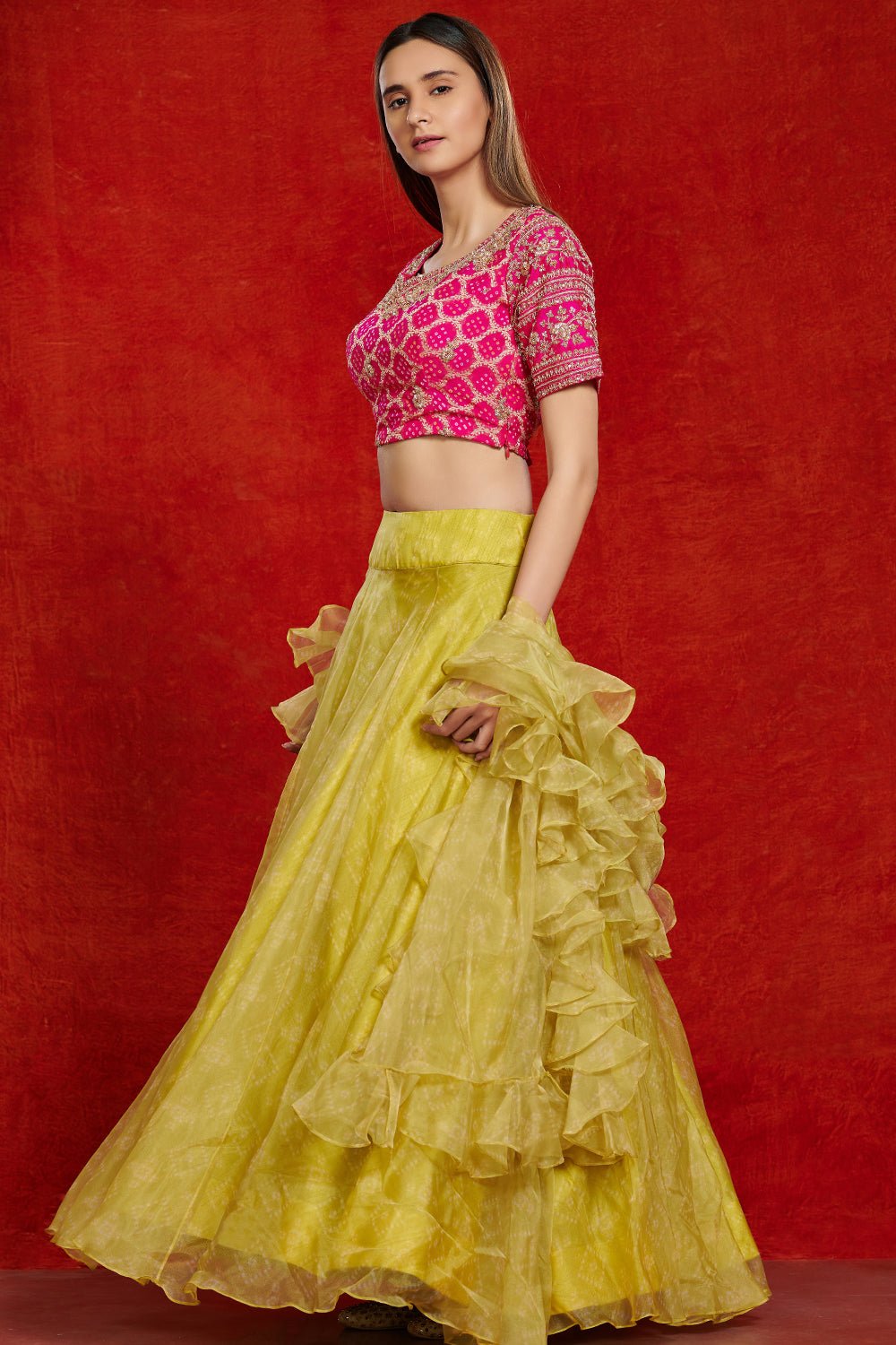 Buy beautiful pink and lime green organza lehenga set online in USA with ruffle dupatta.  Make a fashion statement on festive occasions and weddings with designer suits, Indian dresses, Anarkali suits, palazzo suits, designer gowns, sharara suits from Pure Elegance Indian fashion store in USA.-right