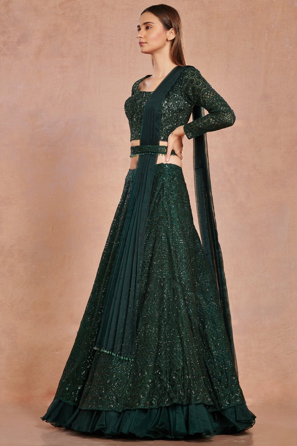 Buy beautiful bottle green shimmer and organza lehenga online in USA with belt.  Make a fashion statement on festive occasions and weddings with designer suits, Indian dresses, Anarkali suits, palazzo suits, designer gowns, sharara suits from Pure Elegance Indian fashion store in USA.-right