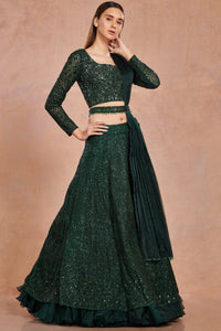 Buy beautiful bottle green shimmer and organza lehenga online in USA with belt.  Make a fashion statement on festive occasions and weddings with designer suits, Indian dresses, Anarkali suits, palazzo suits, designer gowns, sharara suits from Pure Elegance Indian fashion store in USA.-full view