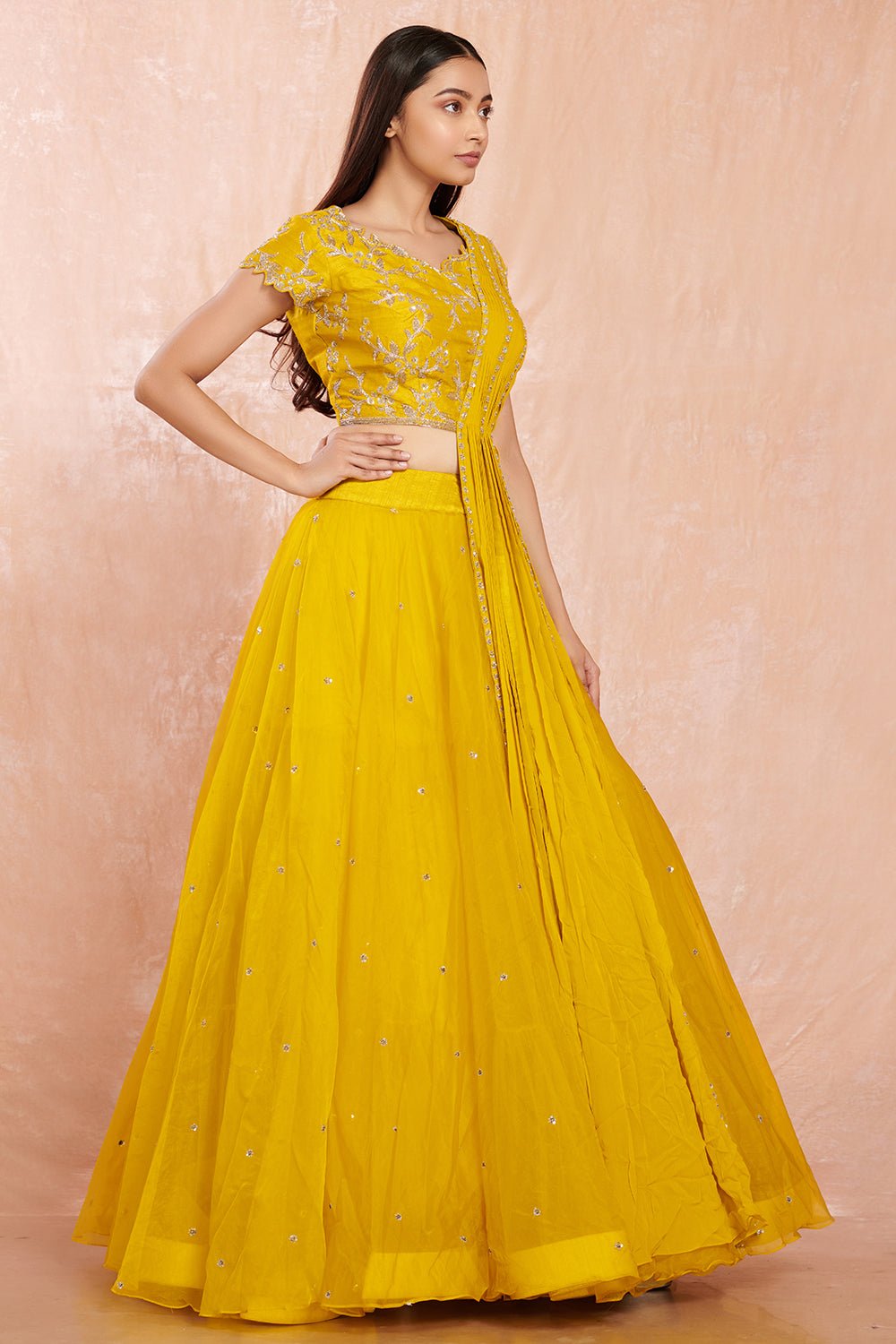 Buy stunning yellow designer net lehenga online in USA with silver floral embroidery.  Make a fashion statement on festive occasions and weddings with designer suits, Indian dresses, Anarkali suits, palazzo suits, designer gowns, sharara suits from Pure Elegance Indian fashion store in USA.-right