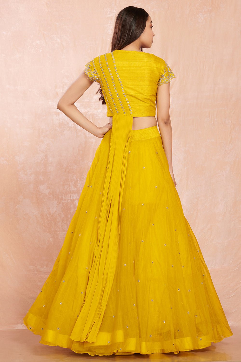 Buy stunning yellow designer net lehenga online in USA with silver floral embroidery.  Make a fashion statement on festive occasions and weddings with designer suits, Indian dresses, Anarkali suits, palazzo suits, designer gowns, sharara suits from Pure Elegance Indian fashion store in USA.-back