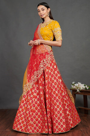 Buy stunning red and yellow embroidered cotton ghagra online in USA. Dazzle on weddings and special occasions with exquisite Indian designer dresses, sharara suits, Anarkali suits, wedding lehengas from Pure Elegance Indian fashion store in USA.-left