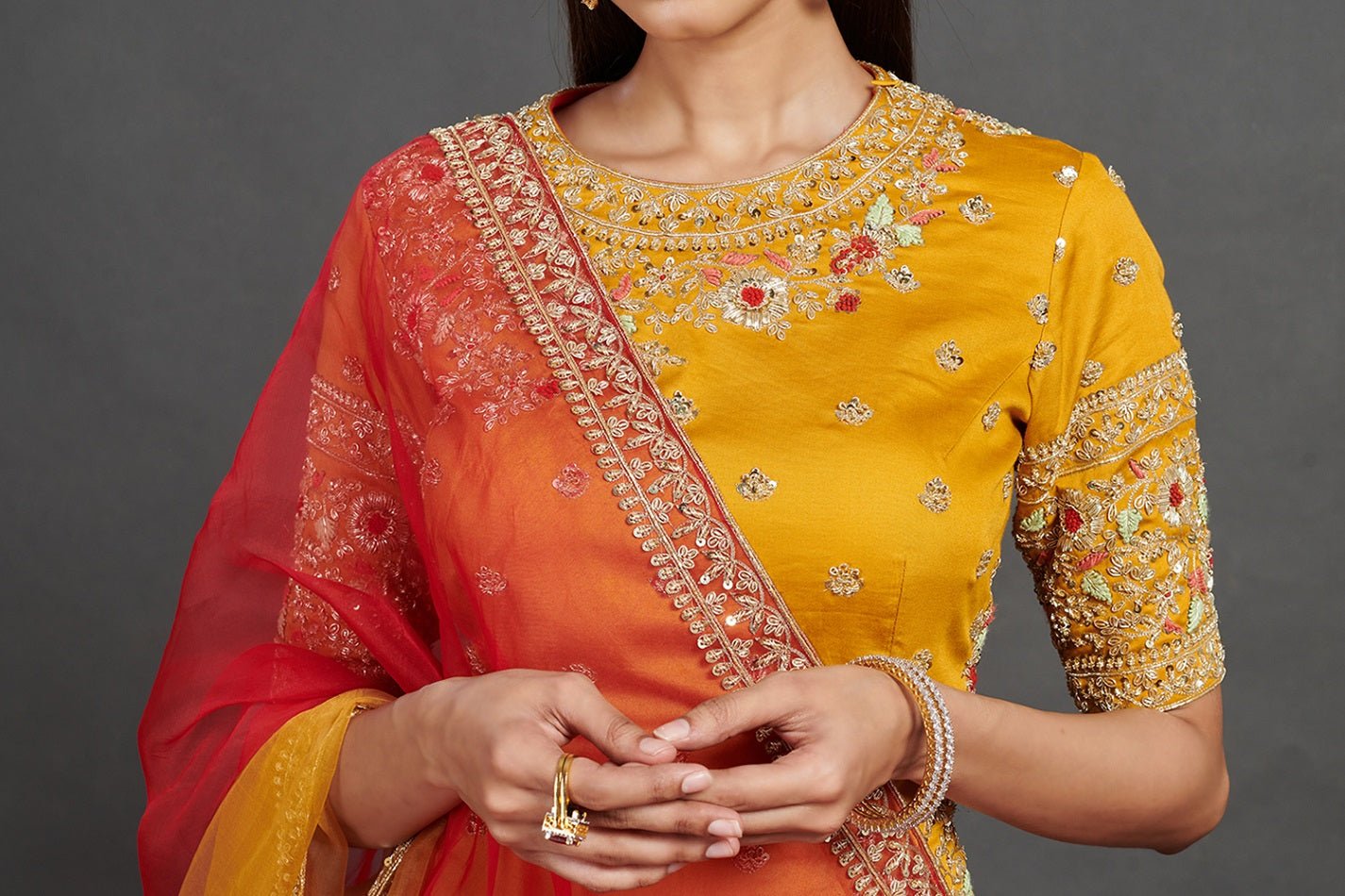 Buy stunning red and yellow embroidered cotton ghagra online in USA. Dazzle on weddings and special occasions with exquisite Indian designer dresses, sharara suits, Anarkali suits, wedding lehengas from Pure Elegance Indian fashion store in USA.-closeup