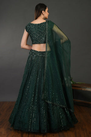 Buy beautiful bottle green embroidered designer lehenga online in USA with dupatta. Dazzle on weddings and special occasions with exquisite Indian designer dresses, sharara suits, Anarkali suits, wedding lehengas from Pure Elegance Indian fashion store in USA.-back