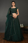 Buy beautiful bottle green embroidered designer lehenga online in USA with dupatta. Dazzle on weddings and special occasions with exquisite Indian designer dresses, sharara suits, Anarkali suits, wedding lehengas from Pure Elegance Indian fashion store in USA.-full view