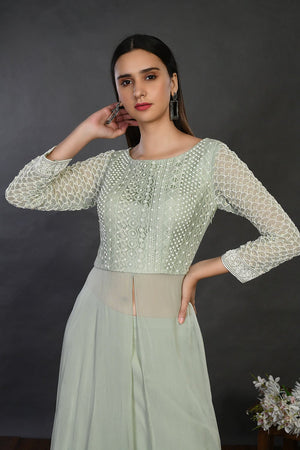 Buy gorgeous pista green embroidered front slit kurta online in USA with palazzo. Dazzle on weddings and special occasions with exquisite Indian designer dresses, sharara suits, Anarkali suits, wedding lehengas from Pure Elegance Indian fashion store in USA.-closeup