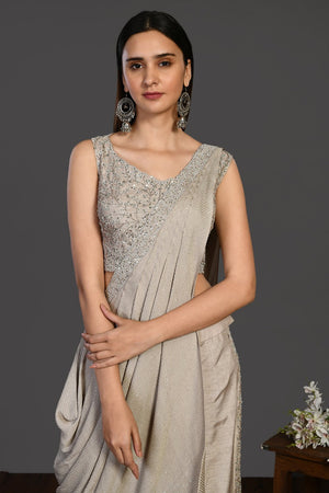 Shop stunning beige embroidered Indo-western dress online in USA. Dazzle on weddings and special occasions with exquisite Indian designer dresses, sharara suits, Anarkali suits, wedding lehengas from Pure Elegance Indian fashion store in USA.-closeup
