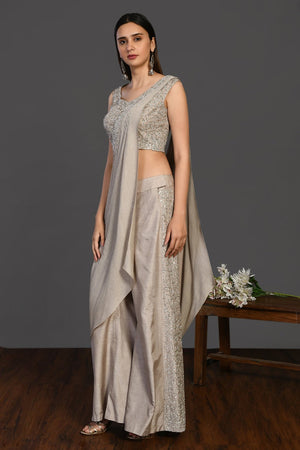 Shop stunning beige embroidered Indo-western dress online in USA. Dazzle on weddings and special occasions with exquisite Indian designer dresses, sharara suits, Anarkali suits, wedding lehengas from Pure Elegance Indian fashion store in USA.-side