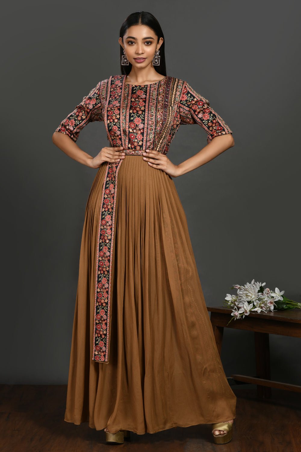 Shop stunning brown maxi dress online in USA with printed bodice. Dazzle on weddings and special occasions with exquisite Indian designer dresses, sharara suits, Anarkali suits, wedding lehengas from Pure Elegance Indian fashion store in USA.-front