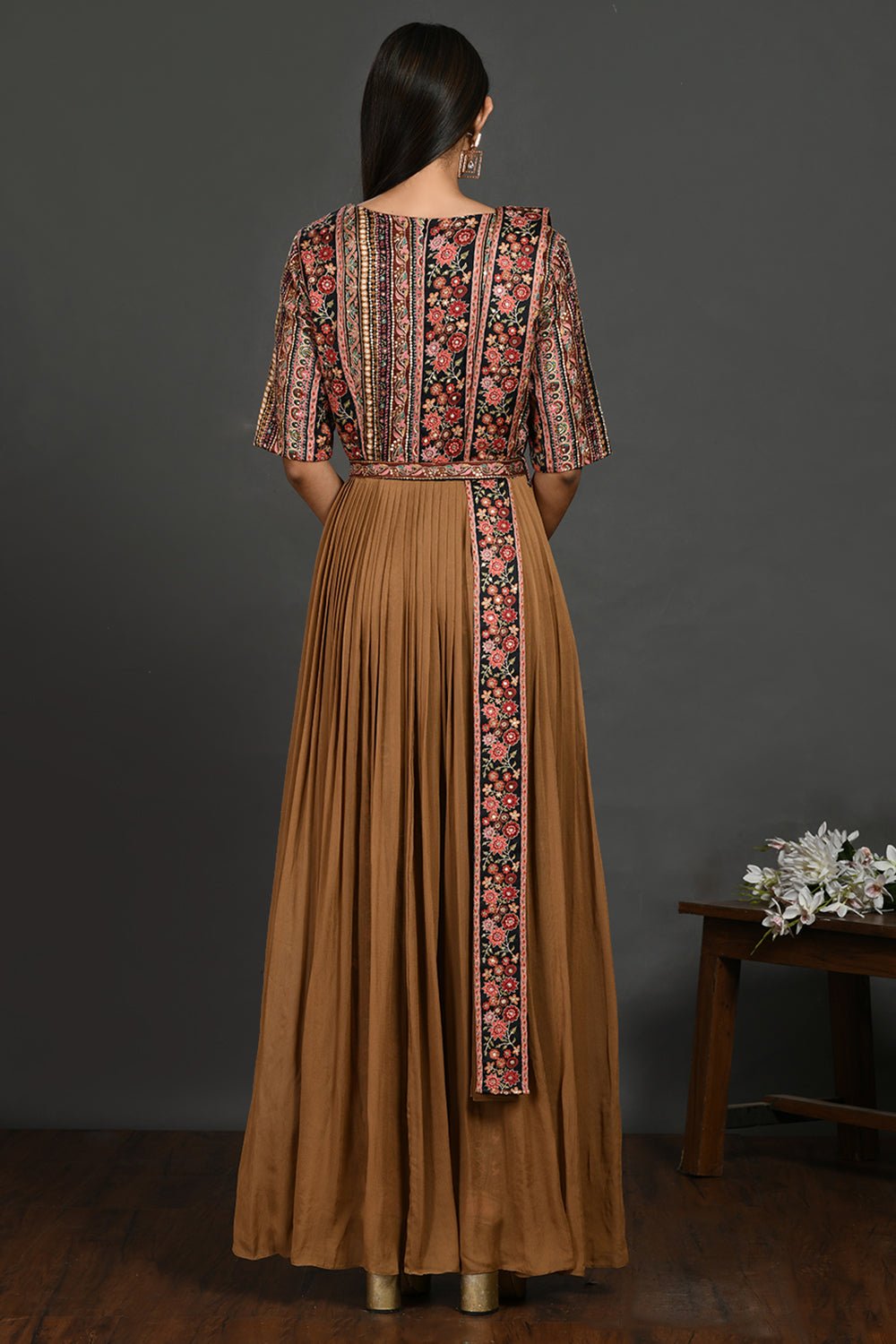 Shop stunning brown maxi dress online in USA with printed bodice. Dazzle on weddings and special occasions with exquisite Indian designer dresses, sharara suits, Anarkali suits, wedding lehengas from Pure Elegance Indian fashion store in USA.-back