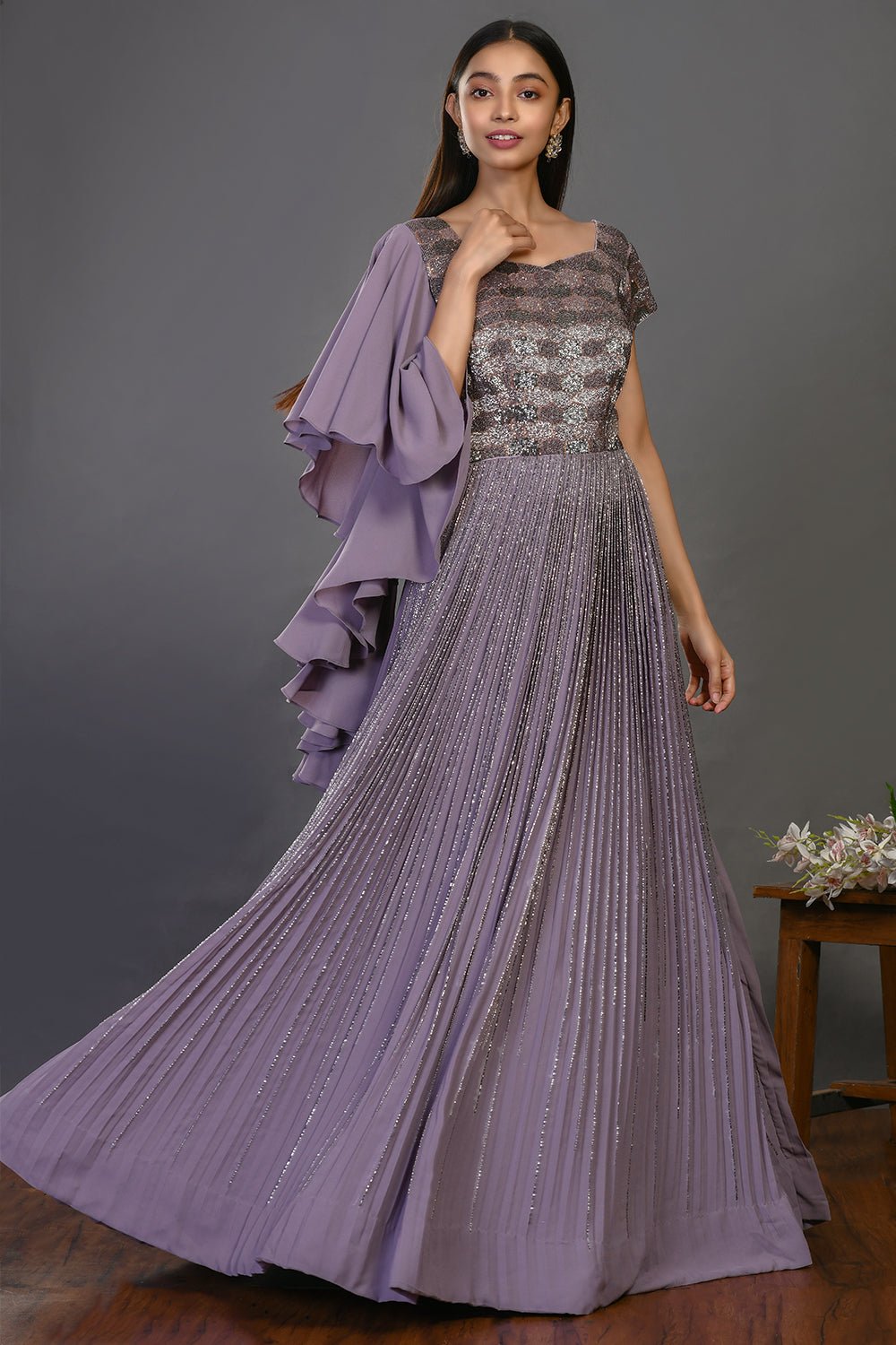 Buy stunning mauve designer gown online in USA with embroidered bodice. Dazzle on weddings and special occasions with exquisite Indian designer dresses, sharara suits, Anarkali suits, wedding lehengas from Pure Elegance Indian fashion store in USA.-ghera