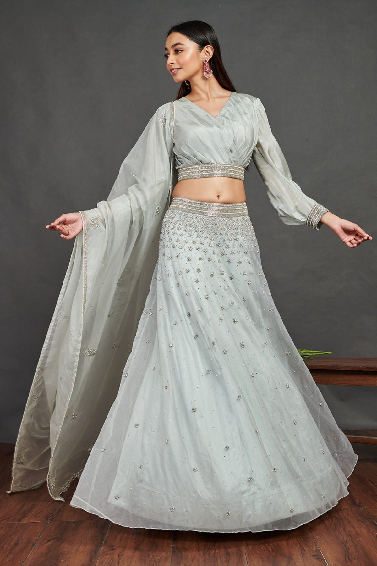 Shop stunning aqua blue embroidered designer lehenga online in USA with dupatta. Dazzle on weddings and special occasions with exquisite Indian designer dresses, sharara suits, Anarkali suits, wedding lehengas from Pure Elegance Indian fashion store in USA.-front