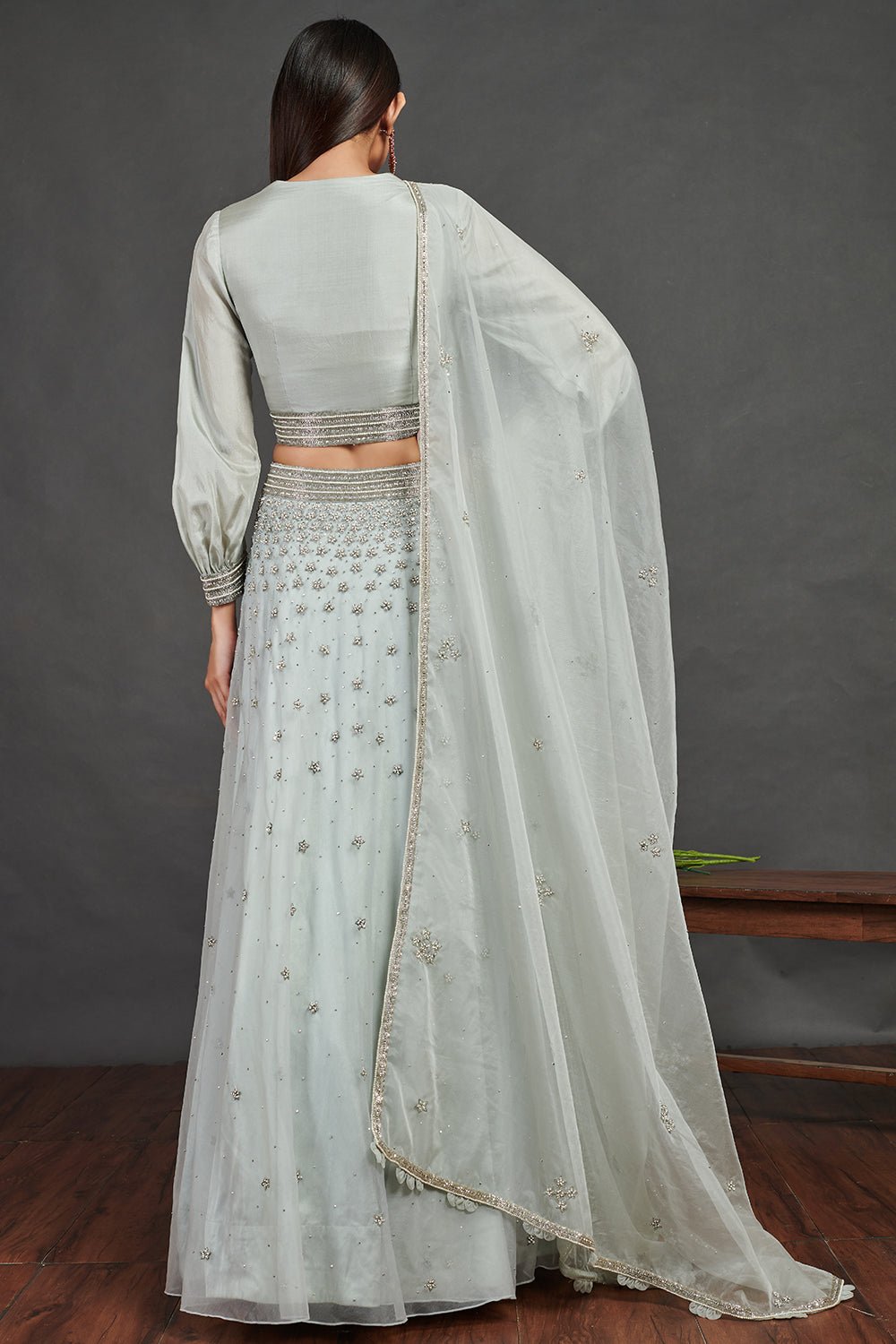 Shop stunning aqua blue embroidered designer lehenga online in USA with dupatta. Dazzle on weddings and special occasions with exquisite Indian designer dresses, sharara suits, Anarkali suits, wedding lehengas from Pure Elegance Indian fashion store in USA.-back