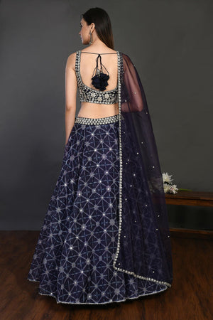 Buy gorgeous blue embroidered designer lehenga online in USA with dupatta. Dazzle on weddings and special occasions with exquisite Indian designer dresses, sharara suits, Anarkali suits, wedding lehengas from Pure Elegance Indian fashion store in USA.-back