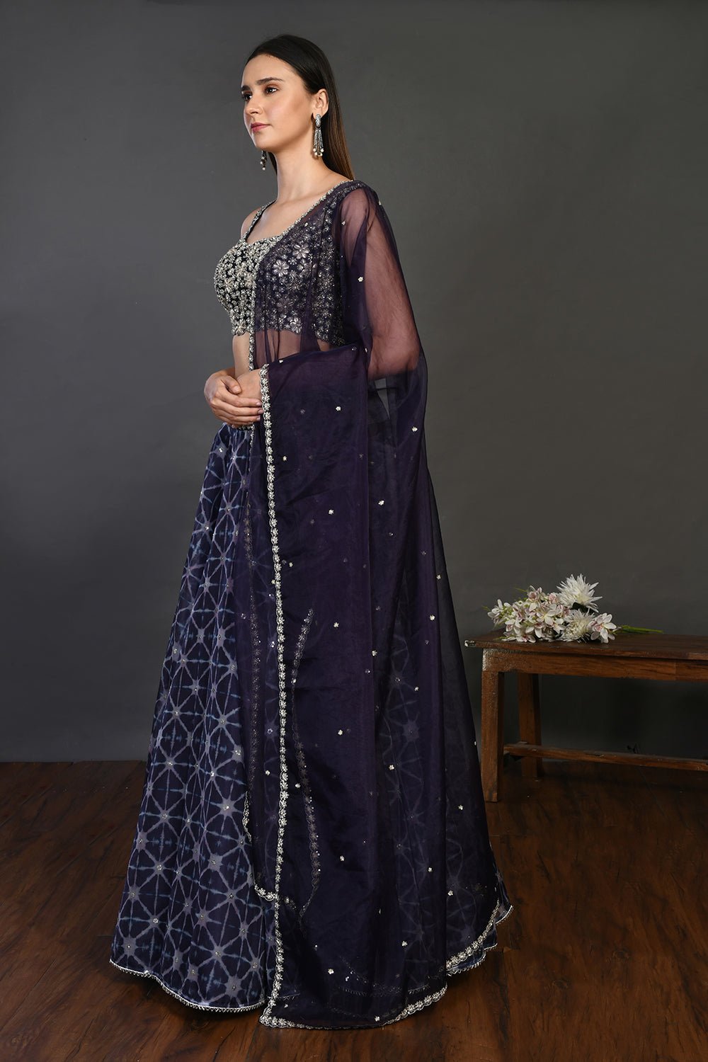 Buy gorgeous blue embroidered designer lehenga online in USA with dupatta. Dazzle on weddings and special occasions with exquisite Indian designer dresses, sharara suits, Anarkali suits, wedding lehengas from Pure Elegance Indian fashion store in USA.-left