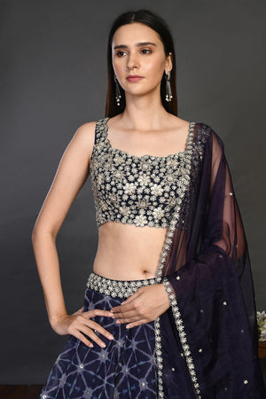 Buy gorgeous blue embroidered designer lehenga online in USA with dupatta. Dazzle on weddings and special occasions with exquisite Indian designer dresses, sharara suits, Anarkali suits, wedding lehengas from Pure Elegance Indian fashion store in USA.-closeup