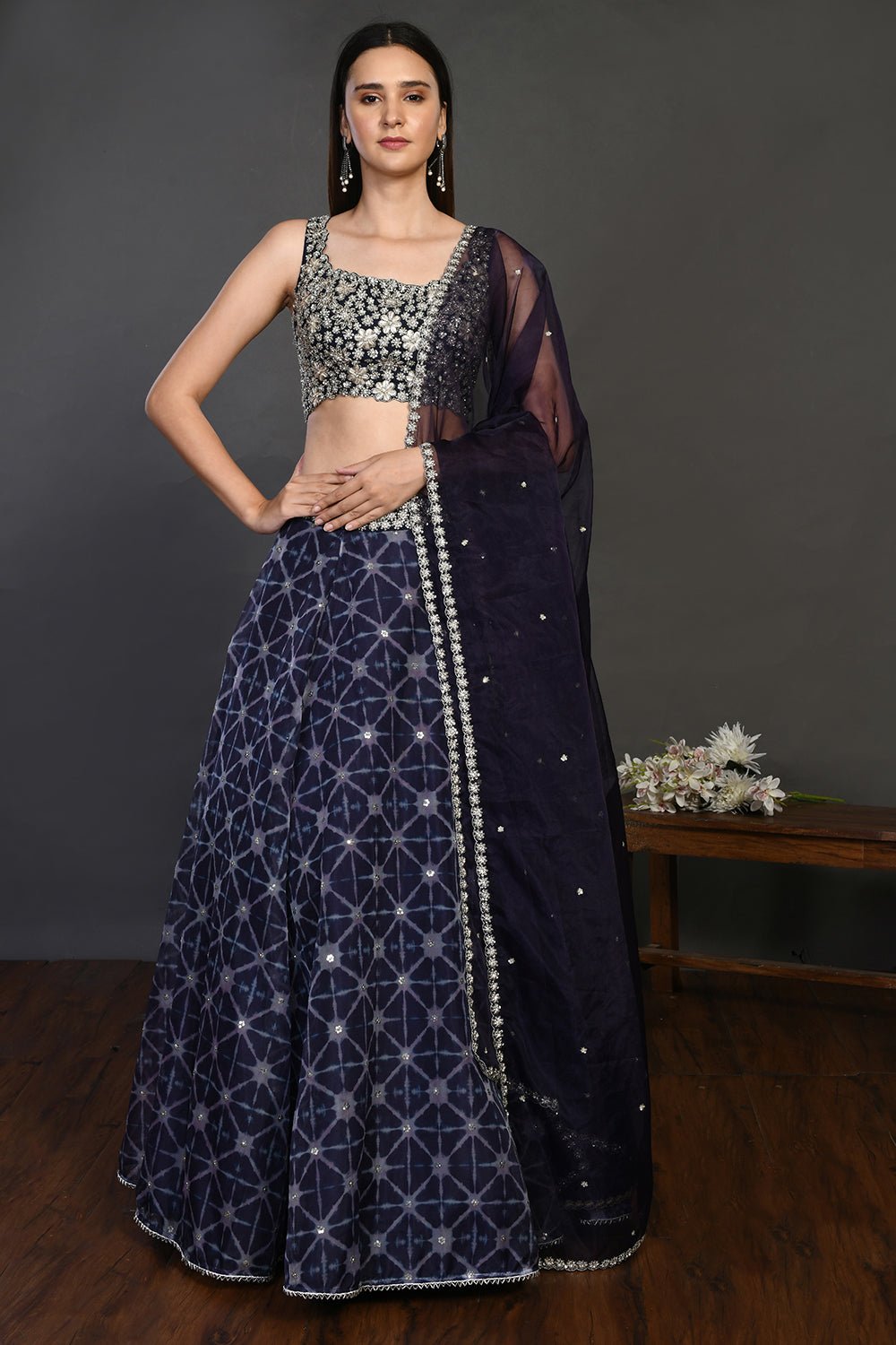 Buy gorgeous blue embroidered designer lehenga online in USA with dupatta. Dazzle on weddings and special occasions with exquisite Indian designer dresses, sharara suits, Anarkali suits, wedding lehengas from Pure Elegance Indian fashion store in USA.-front