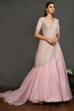 Buy beautiful pastel pink embroidered designer lehenga online in USA with dupatta. Dazzle on weddings and special occasions with exquisite Indian designer dresses, sharara suits, Anarkali suits, wedding lehengas from Pure Elegance Indian fashion store in USA.-side