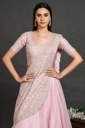 Buy beautiful pastel pink embroidered designer lehenga online in USA with dupatta. Dazzle on weddings and special occasions with exquisite Indian designer dresses, sharara suits, Anarkali suits, wedding lehengas from Pure Elegance Indian fashion store in USA.-closeup