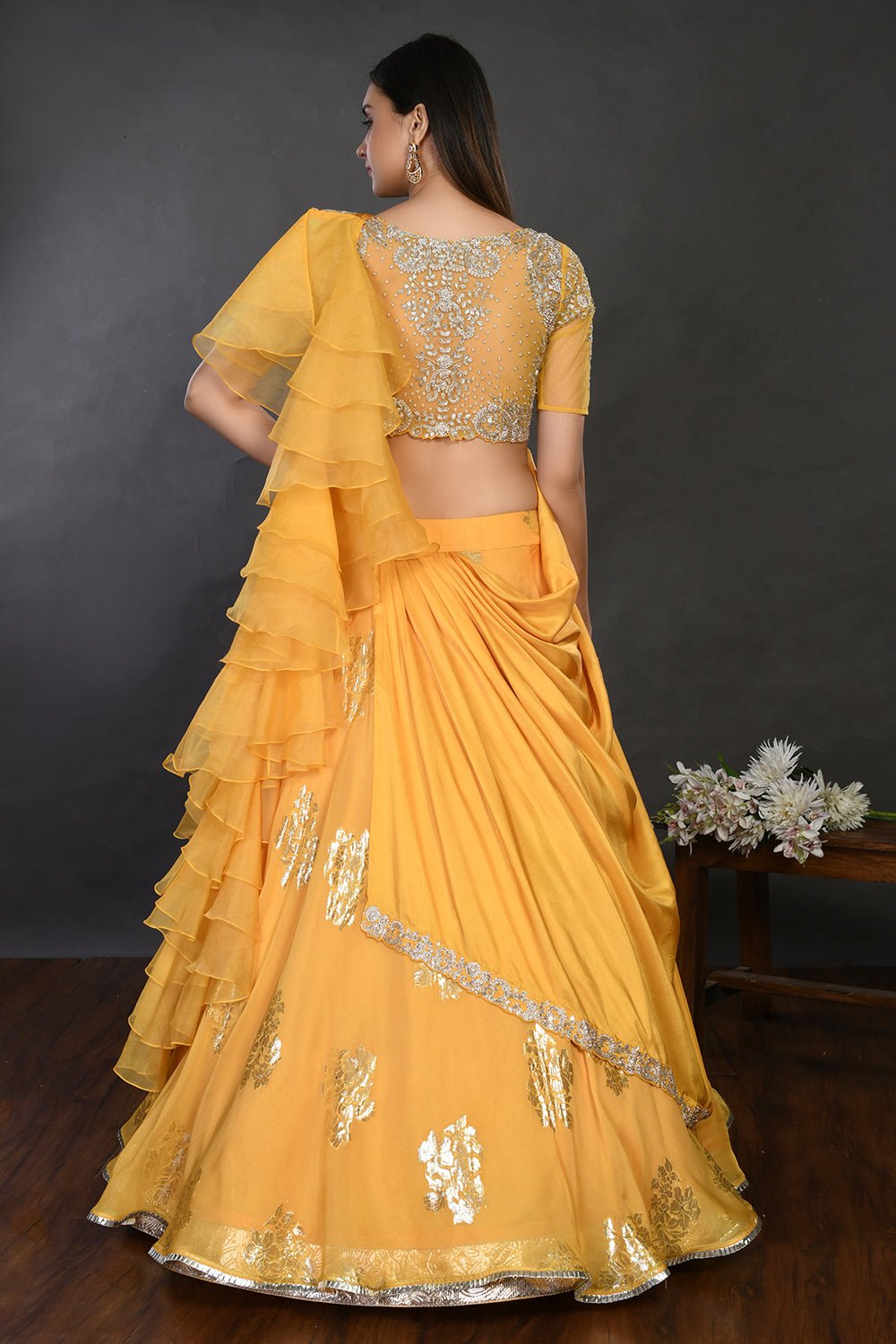 Buy gorgeous yellow embroidered designer lehenga online in USA with dupatta. Dazzle on weddings and special occasions with exquisite Indian designer dresses, sharara suits, Anarkali suits, wedding lehengas from Pure Elegance Indian fashion store in USA.-back