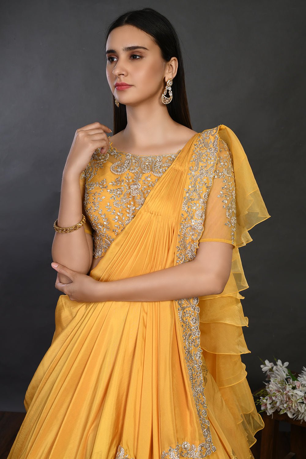 Buy gorgeous yellow embroidered designer lehenga online in USA with dupatta. Dazzle on weddings and special occasions with exquisite Indian designer dresses, sharara suits, Anarkali suits, wedding lehengas from Pure Elegance Indian fashion store in USA.-closeup