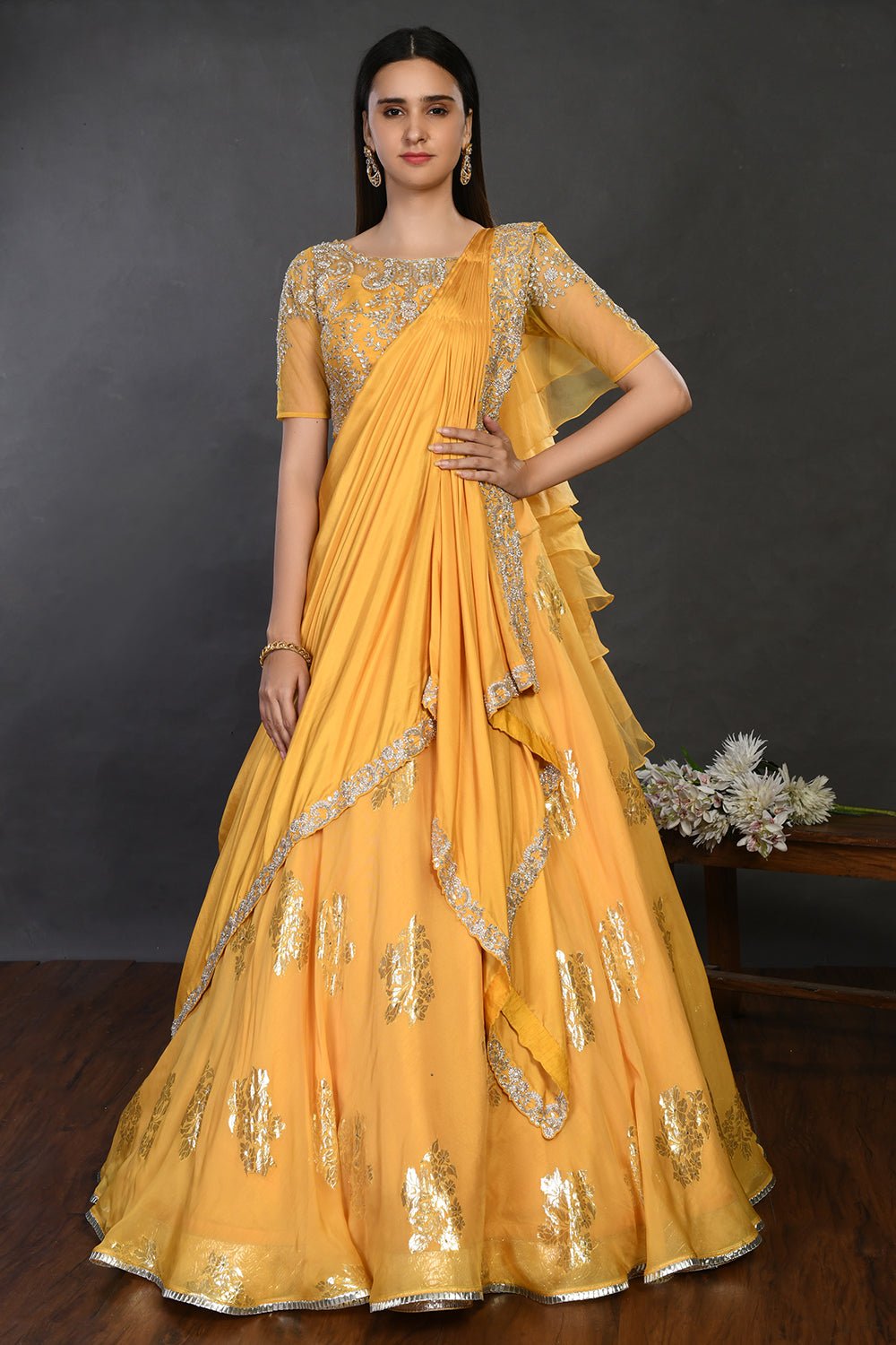 Buy gorgeous yellow embroidered designer lehenga online in USA with dupatta. Dazzle on weddings and special occasions with exquisite Indian designer dresses, sharara suits, Anarkali suits, wedding lehengas from Pure Elegance Indian fashion store in USA.-front