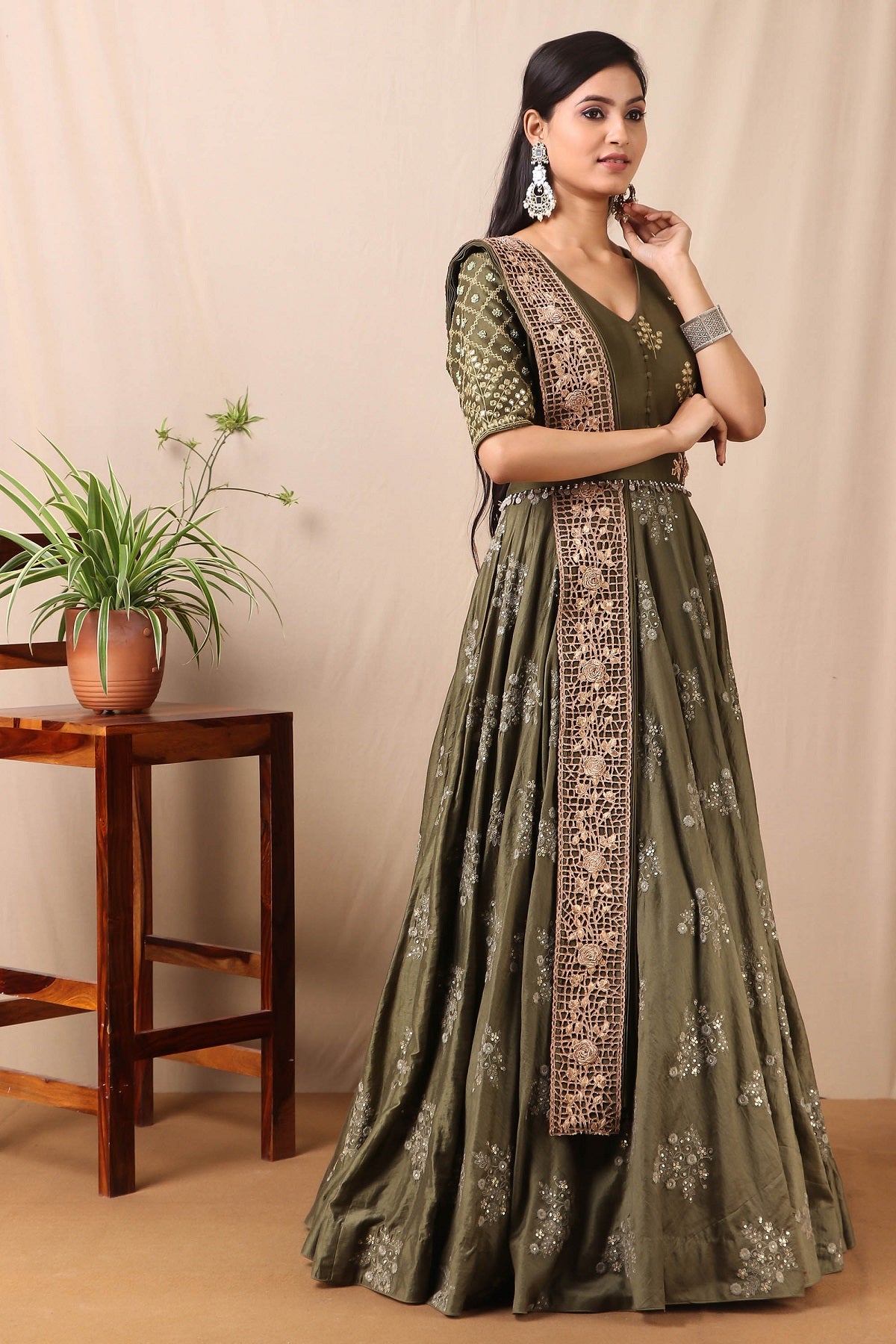 Shop this beautiful kai green embroidered anarkali set with mirror work from Pure Elegance featuring intricate embroidery and a V-neck. Made with premium quality chanderi silk fabric, this set contains a anarkali suit, a dupatta with zari work, and a belt. Pair it up with statement jewellery to complete your look from Pure Elegance Indian clothing store in USA online now.-Side view.