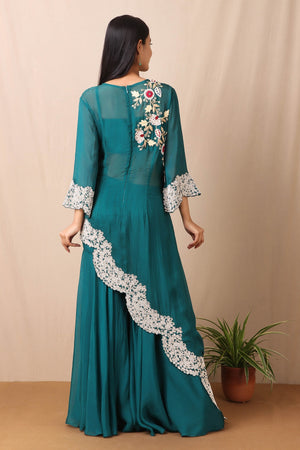 Shop beautiful set of tabby silk green cape style kurta and sharara with thread and pearl work in floral pattern from Pure Elegance. Complete the look by wearing statement jewellery and heels. Light up your ethnic collection of clothing with this kurta sharara set from Pure elegance. It's woven from a fabric that's airy and uber soft against your skin  Pair it up with statement jewellery to complete your look from Pure Elegance Indian clothing store in USA online now.-Back view.