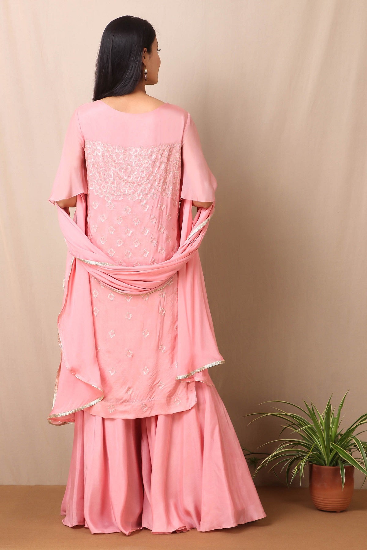 Shop beautiful set of set of Pink Upadda Silk with Satin Organza Sharara and Tabby Dupatta and Tonal Sequins Motifs, lace around the neckline with beautiful tassels on it from Pure Elegance. Light up your ethnic collection of clothing with this kurta and sharara from Pure elegance. It's woven from a fabric that's airy and uber soft against your skin. Pair it up with statement jewellery to complete your look from Pure Elegance Indian clothing store in USA online now.-Back view.