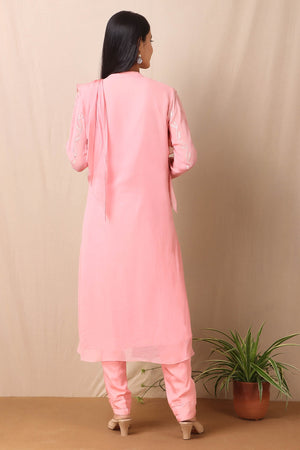 Shop beautiful set of set of  pink georgette embroidered kurta with cotton stretch pants and tabby scarf from Pure Elegance. Complete the look by wearing statement jewellery and heels. Light up your ethnic collection of clothing with this kurta and embelished with light rose gold sequin embroidery. It's woven from a fabric that's airy and uber soft against your skin. Pair it up with statement jewellery to complete your look from Pure Elegance Indian clothing store in USA online now.-Back view.