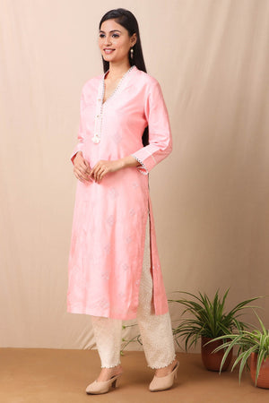 Shop beautiful set of pink upadda silk kurta with tonal sequins motifs and lace around the neckline with beautiful tassels on it and cotton stretch white pant from Pure Elegance. Complete the look by wearing statement jewellery and heels. Light up your ethnic collection of clothing with this kurta cotton white pant set from Pure elegance.  Pair it up with statement jewellery to complete your look from Pure Elegance Indian clothing store in USA online now..-Side view.