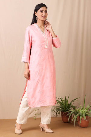 Shop beautiful set of pink upadda silk kurta with tonal sequins motifs and lace around the neckline with beautiful tassels on it and cotton stretch white pant from Pure Elegance. Complete the look by wearing statement jewellery and heels. Light up your ethnic collection of clothing with this kurta cotton white pant set from Pure elegance.  Pair it up with statement jewellery to complete your look from Pure Elegance Indian clothing store in USA online now.-Side view.