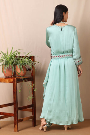 Shop this gorgeous bamberg satin embroidered dress in teel blue color with georgette dupatta featuring a beautiful neckline , belt and cuffs with cutdana and ruby, emerald colored stones, thread embroidery work and dupatta. This beautiful satin material outfit showcases beautiful sleeves with sequin embroidery work and stone work on it and dupatta. Style this set with a pair of diamond earrings and solid pumps to finish the look from Pure Elegance Indian clothing store in USA online now.-Back view.