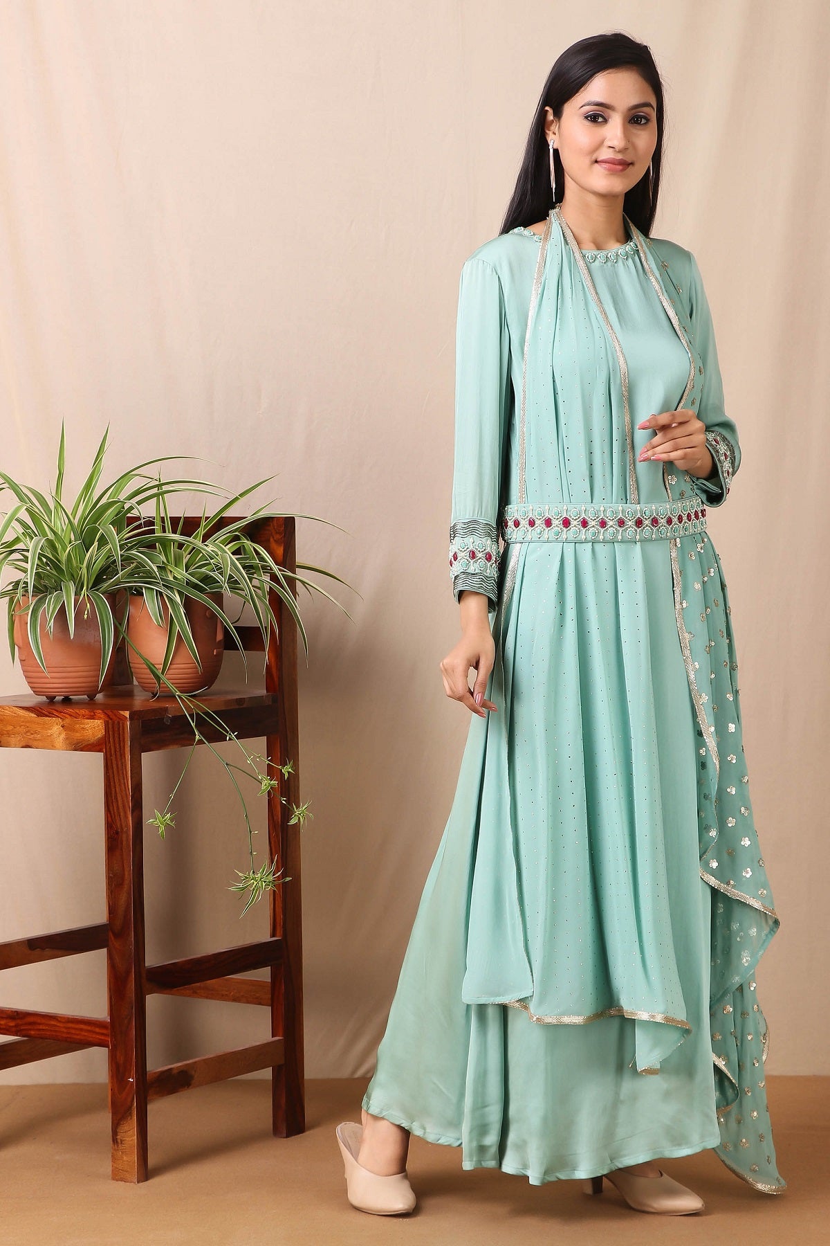 Shop this gorgeous bamberg satin embroidered dress in teel blue color with georgette dupatta featuring a beautiful neckline , belt and cuffs with cutdana and ruby, emerald colored stones, thread embroidery work and dupatta. This beautiful satin material outfit showcases beautiful sleeves with sequin embroidery work and stone work on it and dupatta. Style this set with a pair of diamond earrings and solid pumps to finish the look from Pure Elegance Indian clothing store in USA online now.-Full view.