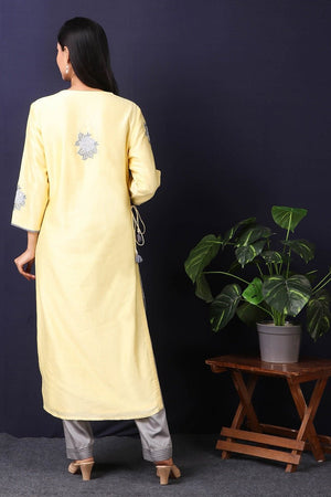 Shop this this gorgeous lemon yellow-grey chanderi kurta set with cotton stretch pant in rose motifs in grey color, a beautiful neckline. This beautiful chanderi silk material outfit showcases beautiful sleeves with rose motifs work offering a comfortable fit. Style this set of kurta and pant with a pair of diamond earrings and solid pumps to finish the look from Pure Elegance Indian clothing store in USA online now.-Back view.