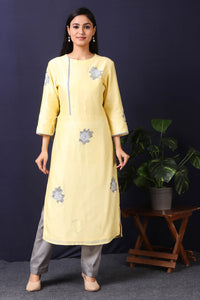 Shop this this gorgeous lemon yellow-grey chanderi kurta set with cotton stretch pant in rose motifs in grey color, a beautiful neckline. This beautiful chanderi silk material outfit showcases beautiful sleeves with rose motifs work offering a comfortable fit. Style this set of kurta and pant with a pair of diamond earrings and solid pumps to finish the look from Pure Elegance Indian clothing store in USA online now.-Full view.