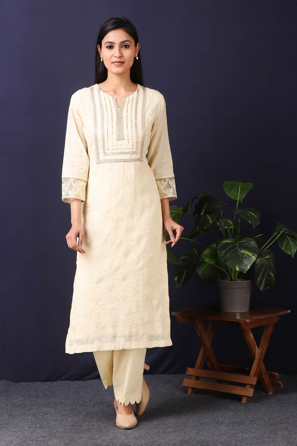 Shop this this gorgeous  mulmul cotton kurta in cream color with cotton stretch pants with sequin and thread embroidery work with gota detailing on neckline. This beautiful mulmul cotton material outfit showcases beautiful sleeves with lace work on it. Style this set of kurta with a pair of diamond earrings and solid pumps to finish the look from Pure Elegance Indian fashion store in USA online now.-Full view.