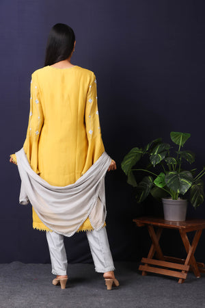 Shop this mustard-grey satin organza pakistani kurta with crepe pant and stole with mirror work with lace edging all over. This beautiful satin organza material outfit showcases beautiful sleeves with lace work on it. Style this set of kurta with a pair of diamond earrings and solid pumps to finish the look from Pure Elegance Indian fashion store in USA online now.-back view.
