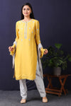Shop this mustard-grey satin organza pakistani kurta with crepe pant and stole with mirror work with lace edging all over. This beautiful satin organza material outfit showcases beautiful sleeves with lace work on it. Style this set of kurta with a pair of diamond earrings and solid pumps to finish the look from Pure Elegance Indian fashion store in USA online now.-Full view.